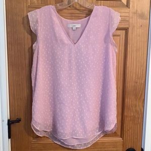 Swiss dot sleeveless flutter top.